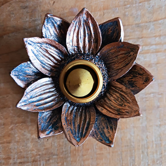 Backflow incense burner in a bronze lotus flower design. When the cone is lit the smoke from the cone cascades downwards in a mesmerizing waterfall effect to pool at the bottom. Beautiful to watch.