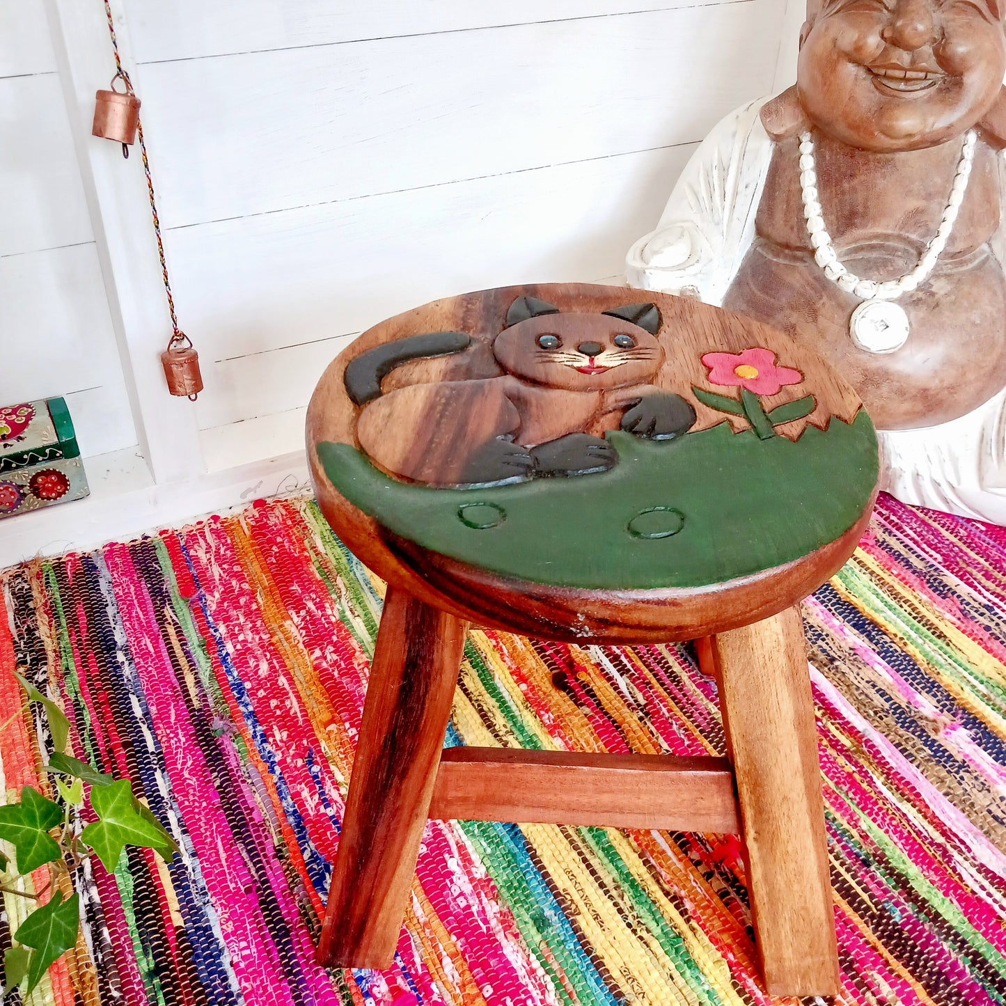 Bring a sprinkle of wonder into your sacred space with this charming hand-painted Cute Cat Stool. Carved from sustainable wood and finished with natural wax, it’s not just adorable—it’s versatile too. Whether you're grounding yourself on it during morning meditation, using it as a fairy table for crystals and incense, or just resting your weary feet, this little cat is pure joy.