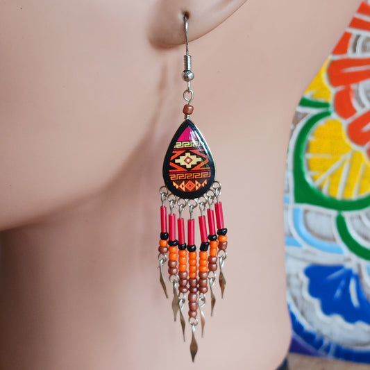 Add a touch of artisan elegance to your jewellery collection with these stunning handmade Peruvian Incan teardrop earrings. Carefully crafted in small family-run workshops in Peru, these eye-catching earrings feature traditional Incan-inspired patterns on the front with a contrasting black reverse for a striking finish.