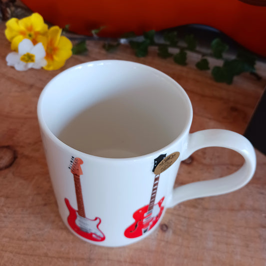 The Electric Guitars Mug by The Leonardo Collection. Featuring 6 unique electric guitars, this mug makes a brilliant gift for someone who loves guitars! With a simple but striking design, this mug is a great addition to a mug collection.