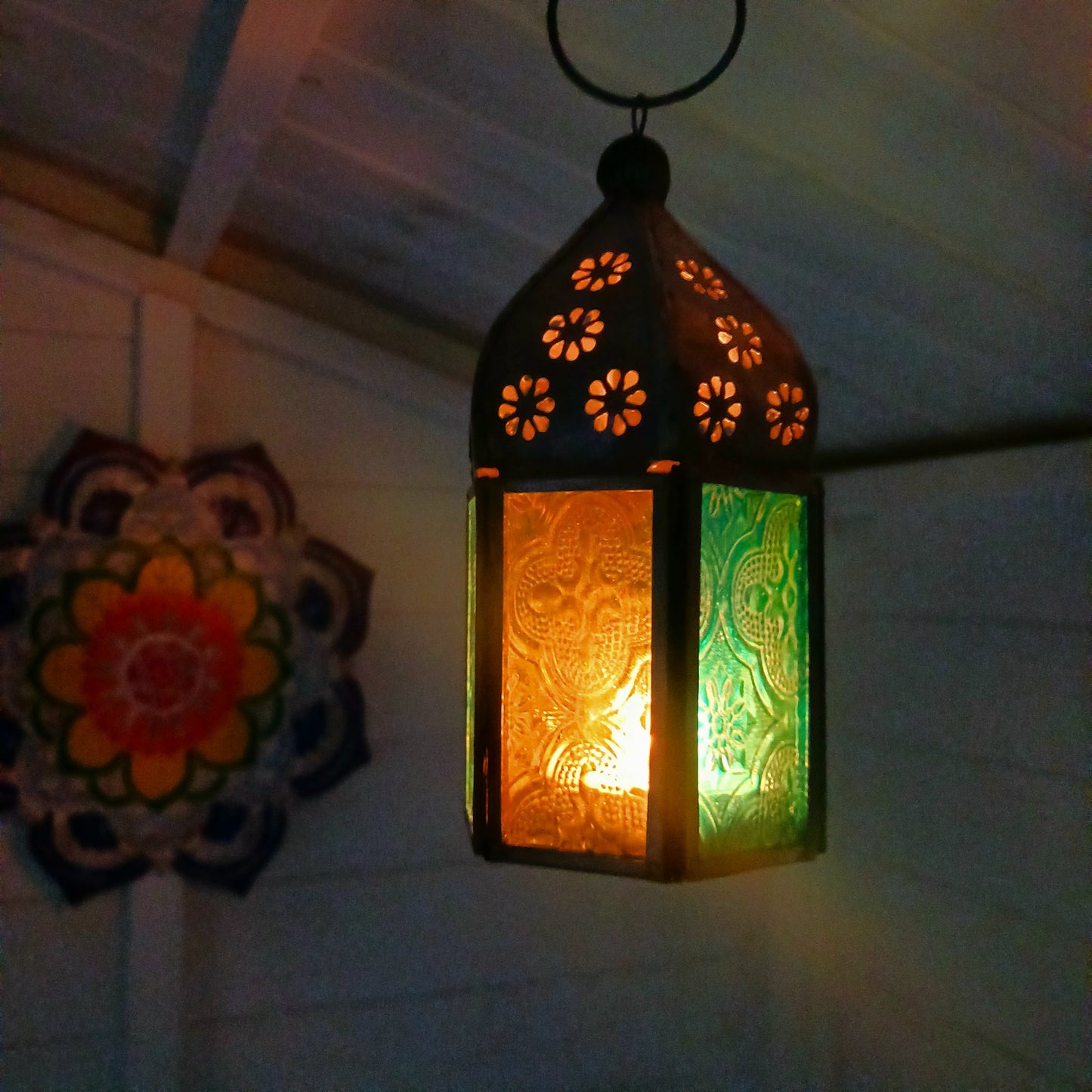These small glass lanterns come in wonderful colours, featuring an intricate embossed pattern. They have a small hinged door that closes with a sliding catch. The small handle on the top is great for hanging the lanterns around your home. Perfect for adding a touch of warmth to your space.