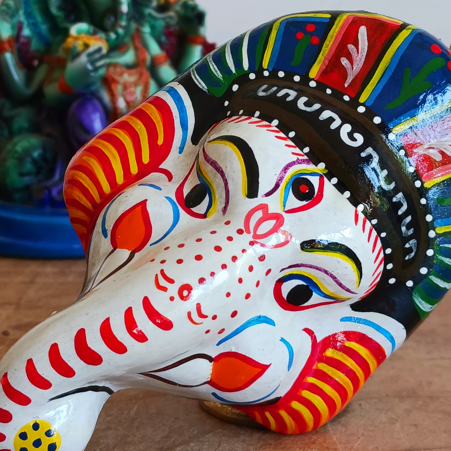 Bring the blessings of Ganesh into your home with this handcrafted terracotta mask from Nepal. Known as the remover of obstacles and the deity of wisdom, learning, and new beginnings, Ganesh is one of the most beloved figures in Hindu tradition. His elephant head and gentle features are beautifully captured in this spiritual wall hanging.