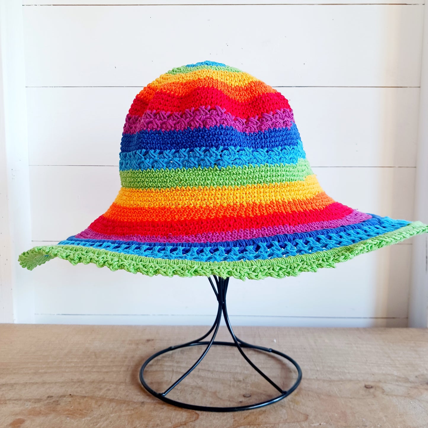 This lovely crochet cotton summer sun hat is perfect for summertime with it's vibrant rainbow colours. Each hat has a malleable wire woven into the rim to help keep the shape. Ideal for holidays and festivals.