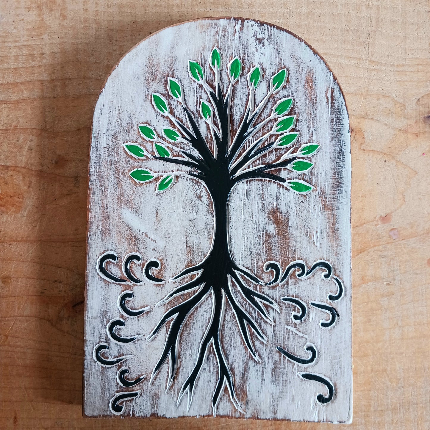 Bring meaningful symbolism and artisan beauty into your space with this chunky hand-carved wood plaque from Bali, Indonesia. Carefully crafted and painted by skilled artisans, this decorative piece features intricate etchings of the Tree of Life, a universal symbol found in many cultures and spiritual traditions.