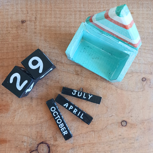 Bring the charm of the seaside to your workspace with our Handmade Wooden Boat Desk Calendar. Expertly crafted from quality wood and designed with vibrant, playful colours, this unique desk calendar combines practical organization with coastal-inspired décor.