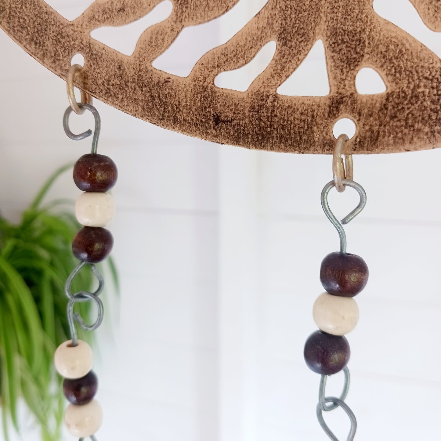 Bring the timeless symbolism of the Tree of Life to your home with this beautiful Tree of Life windchime. Made in India from quality brass, this 25 cm chime features a beautifully detailed Tree of Life design, adorned with Indian beads. Each branch of the tree is a reminder of growth, connection, and harmony, while the soothing sounds of the bells offer peace to any space.