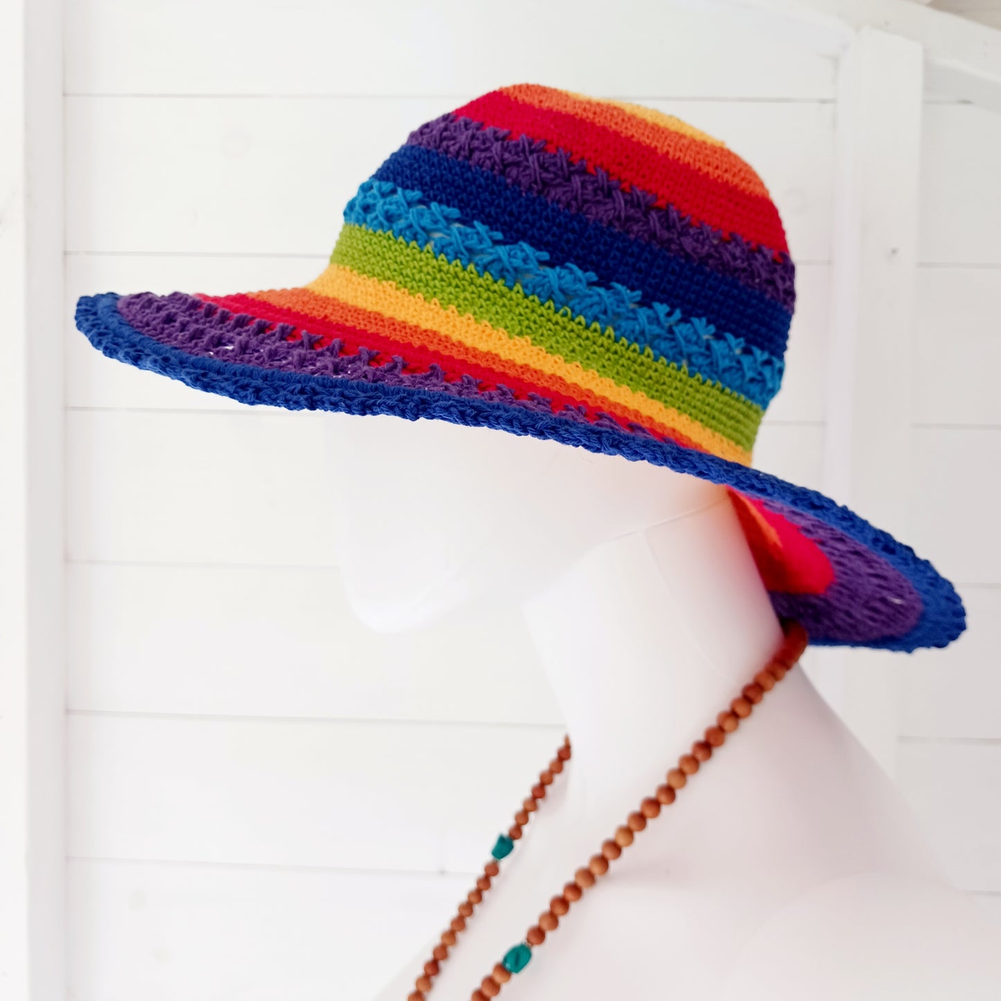 Handmade rainbow crochet sun hat with a flexible brim. Perfect for holidays, beach days & festivals. Unique, lightweight, and ready for sunny adventures!