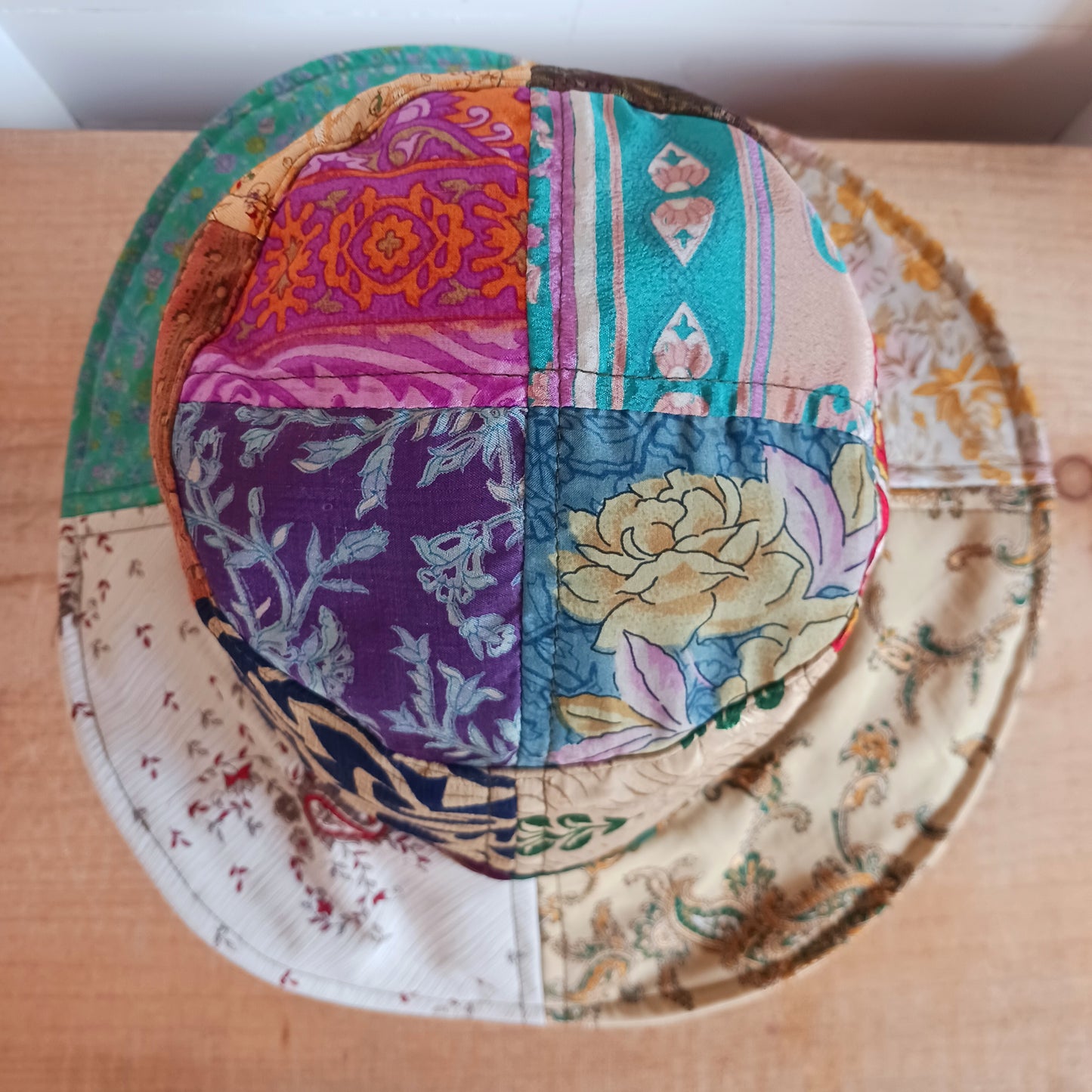 A swell little number for festivals and summer times, you'll look the coolest in this recycled sari patchwork sun hat. Black polyester lined, with a slightly flexible brim for adjusting the shape.