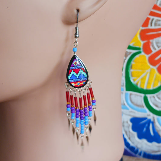 Add a touch of artisan elegance to your jewellery collection with these stunning handmade Peruvian Incan teardrop earrings. Carefully crafted in small family-run workshops in Peru, these eye-catching earrings feature traditional Incan-inspired patterns on the front with a contrasting black reverse for a striking finish.