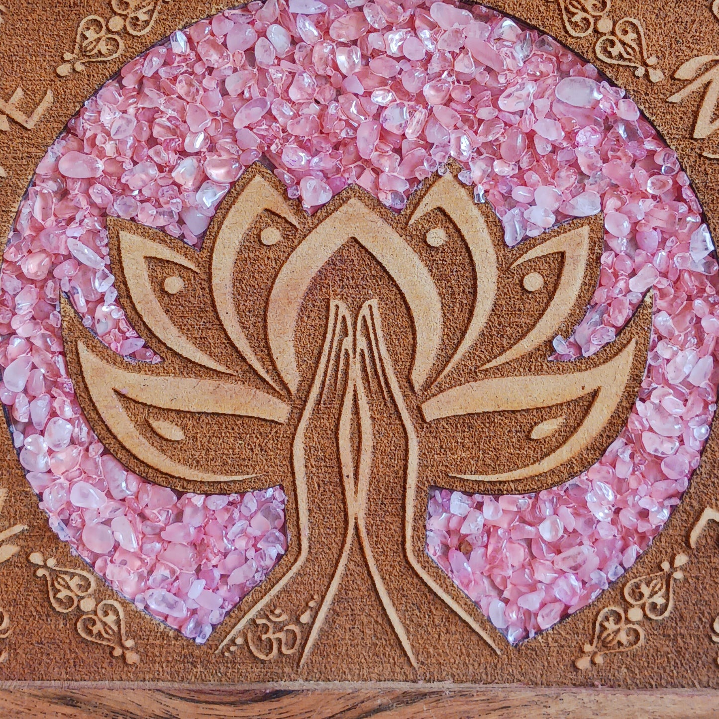 Keep your cherished items safe in this beautifully crafted mango wood jewellery box, engraved with the word ‘Namaste’. A Sanskrit greeting meaning “the divine in me greets the divine in you,” it serves as a daily reminder of connection, presence, and mutual respect. Accented with rose quartz—symbolizing love, compassion, and emotional healing—this box is ideal for storing jewellery, keepsakes, cards, or other personal treasures. Subtle, spiritual, and thoughtful, it’s a meaningful addition to any space.
