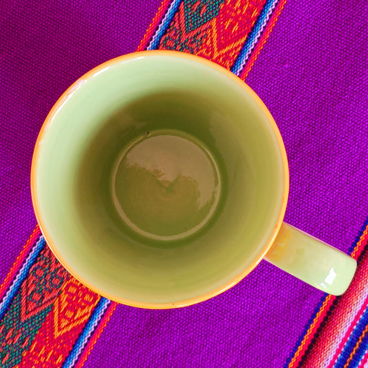 The rainbow stripe is hand painted before it is fired and finishes it beautifully. Narrower in diameter at the bottom and widening towards the rim, these Thai ceramics are traditionally made, hand painted with a pale green interior and finished to a shine glaze highlighting the vibrant multi colours perfectly.