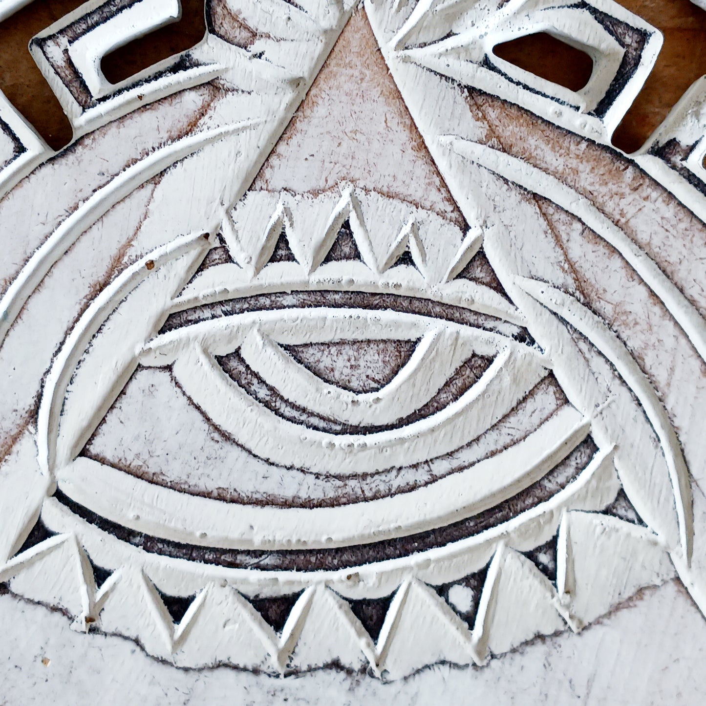 This wooden plaque has been intricately carved by hand to represent the Eye of Providence. The Eye of Providence or All-Seeing Eye is a symbol depicting an eye, often enclosed in a triangle and surrounded by a ray of light or a halo, intended to represent Providence, as the eye watches over the workers of mankind. In Christianity it serves as a reminder that humanitiy's thoughts and deeds are always obserbed by God.