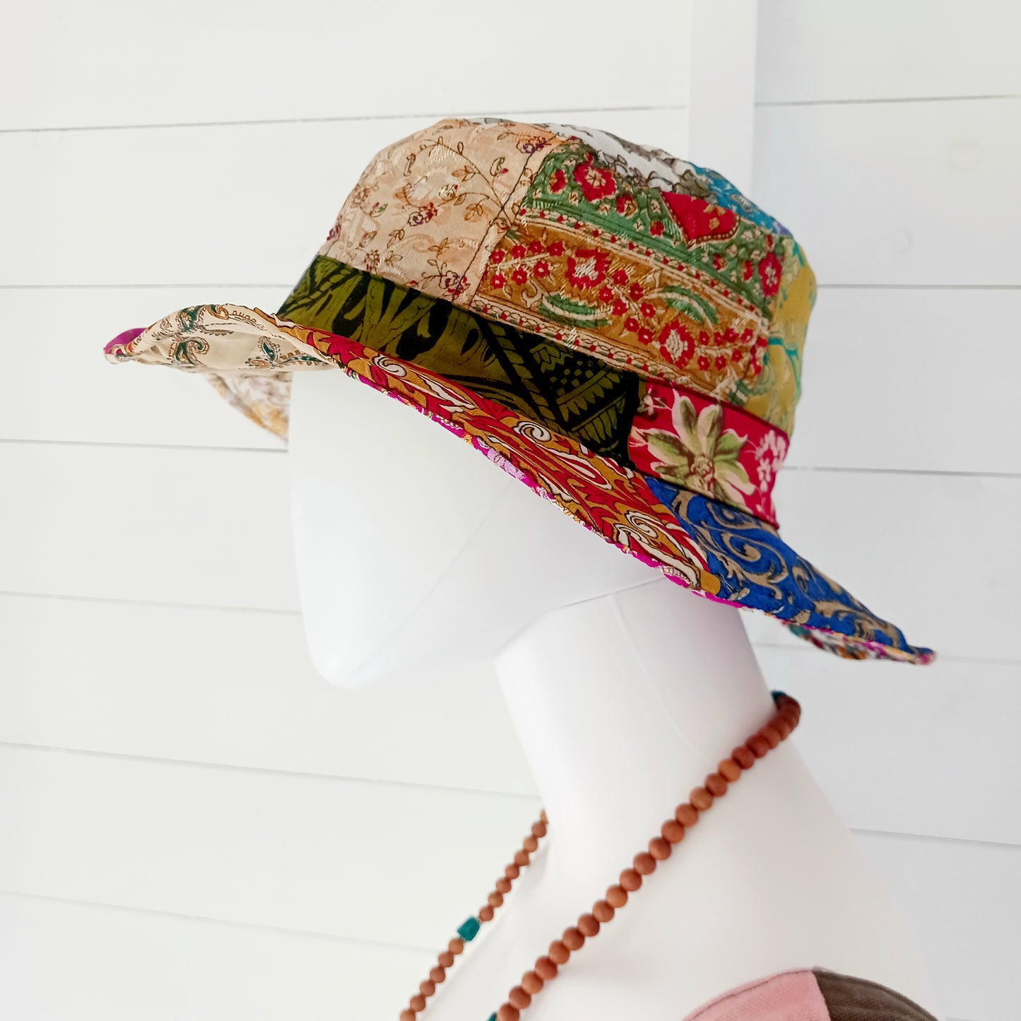 A swell little number for festivals and summer times, you'll look the coolest in this recycled sari patchwork sun hat. Black polyester lined, with a slightly flexible brim for adjusting the shape.