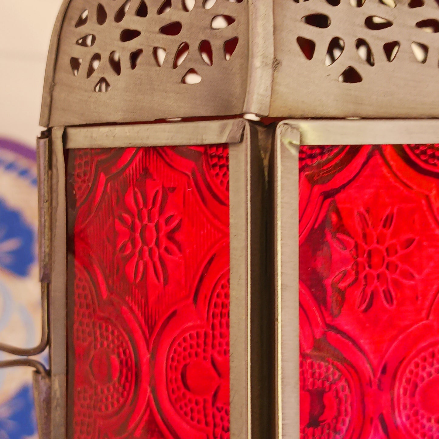 These small glass lanterns come in wonderful colours, featuring an intricate embossed pattern. They have a small hinged door that closes with a sliding catch. The small handle on the top is great for hanging the lanterns around your home. Perfect for adding a touch of warmth to your space.