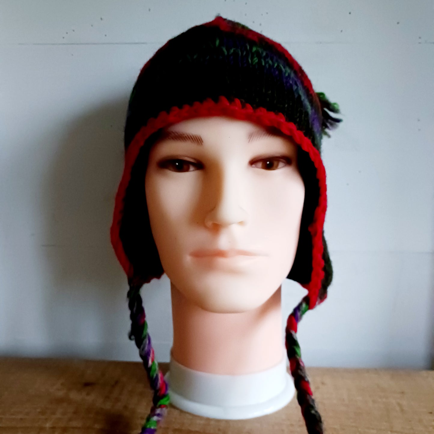Stay cozy and stylish with our handmade chunky wool earflap hats, crafted in Nepal by skilled women artisans in Kathmandu. Each hat is 100% pure wool and features a soft polar fleece lining for extra warmth and comfort. Perfect for cold winter days, outdoor adventures, or adding a touch of handmade charm to your look.