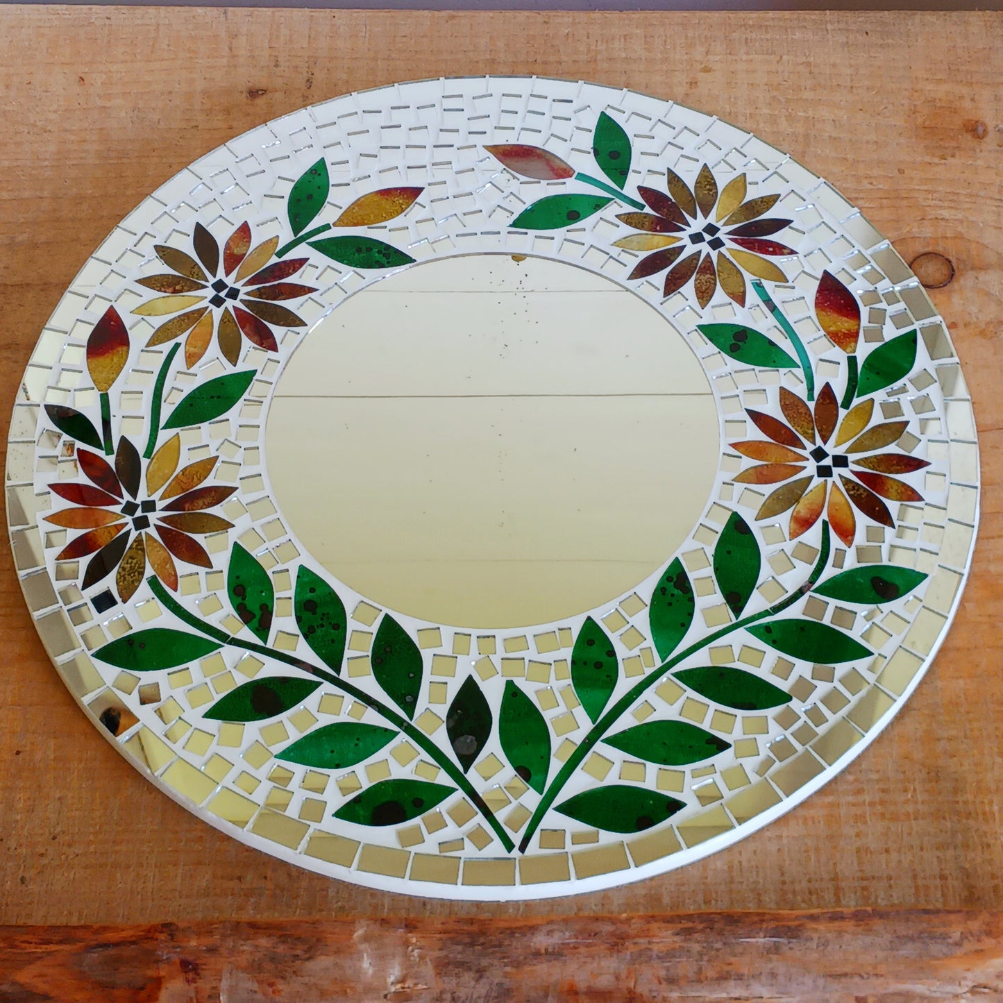 Transform any room into a vibrant oasis with our large Handmade Mosaic Floral Mirror. Crafted with care, this stunning mirror features a bright floral mosaic design that instantly adds style and colour to your décor. Perfect as a statement piece for living rooms, bedrooms, hallways, or entryways, it reflects not only light but also personality. Each mirror is uniquely handmade, making it a one-of-a-kind addition to your home.
