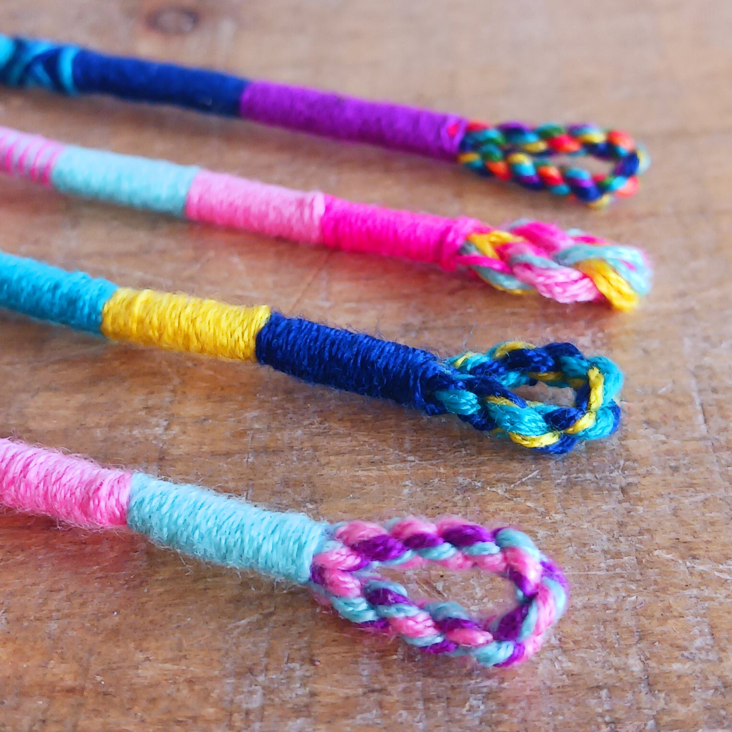Add meaning and colour to your everyday style with these beautifully handcrafted Thai friendship bracelets. Featuring vibrant crisscross woven designs, each bracelet is a symbol of connection, kindness, and heartfelt wishes.