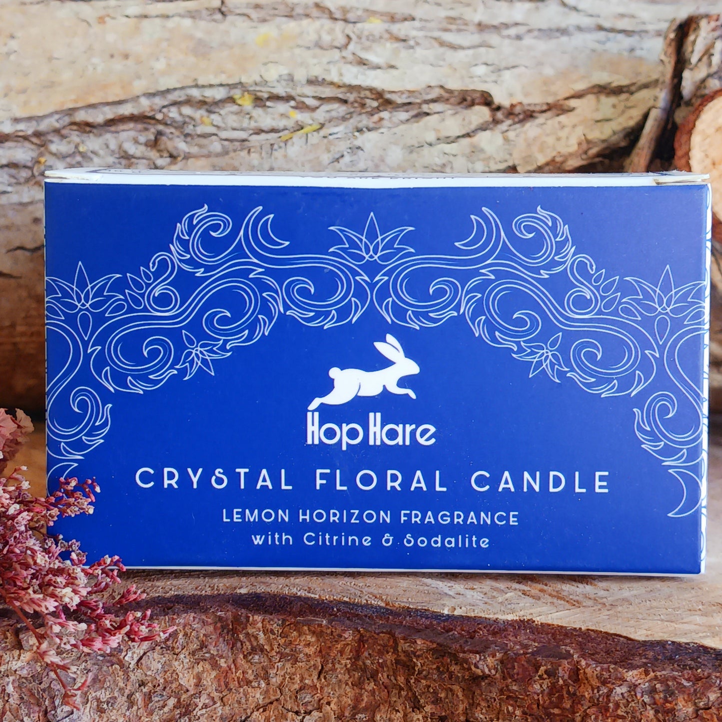 Step into the mystical world with Hop Hare Crystal Magic Flower Candle - The Sun, crafted with Citrine and Sodalite Gemstone with the addition of dry flowers.