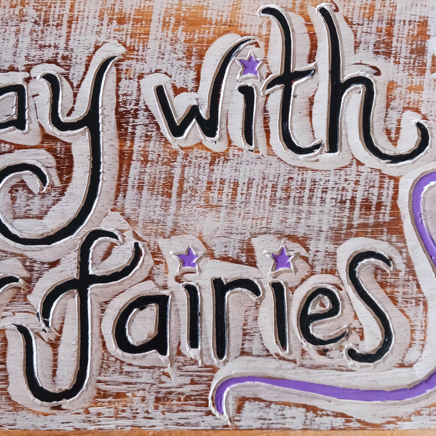 Whimsical handmade wall plaque with fairy-themed design. Ideal for gardens or interiors. Crafted in Indonesia with etched text and colourful star accents.