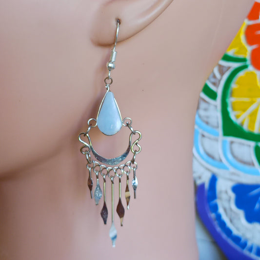 These beautiful earrings incorporate a pale blue stone with Silver plated hooks. They earrings have been hand made in Peru and are presented in a traditionally made pouch gift wrapped and ready to give ☸