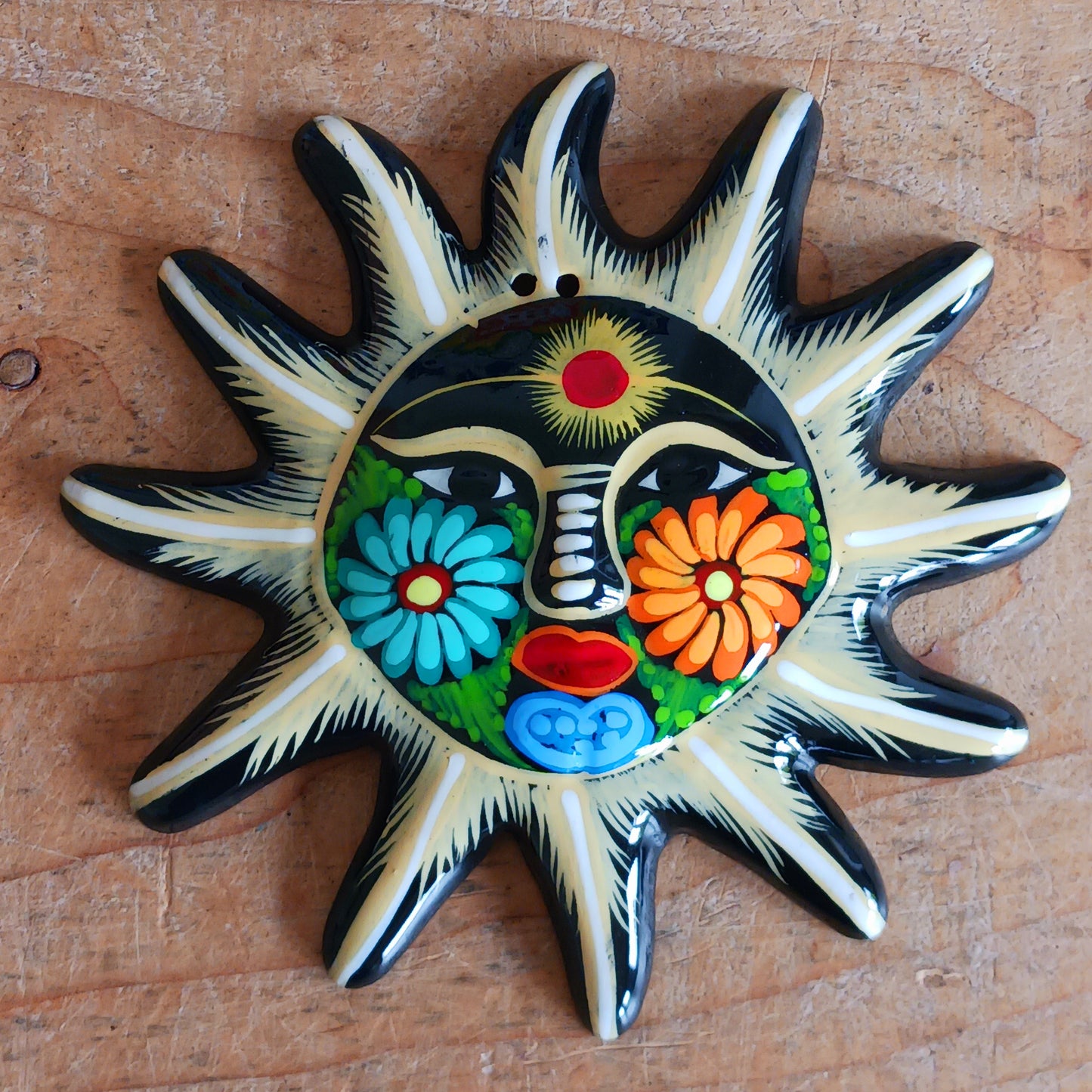 Add a burst of colour with this vibrant, hand-painted Xalitla wall plaque. Traditional Mexican folk art with a glossy finish and easy hanging design.