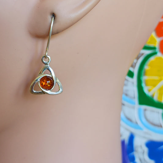 These beautiful amber goddess triquetra earrings have a stunning 4mm amber round cabochon, set within a lovey goddess triquetra knot.
