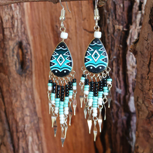 These beautiful and eye-catching earrings are handmade in Peru and feature traditional Incan patterns on the front, the back is coloured black. They are shaped in a teardrop style and are finished with coloured coordinating beads, silver embellishments and silver-plated hooks. Ideal for a night out, for dressing up your Boho look or as a gift for family or friends.