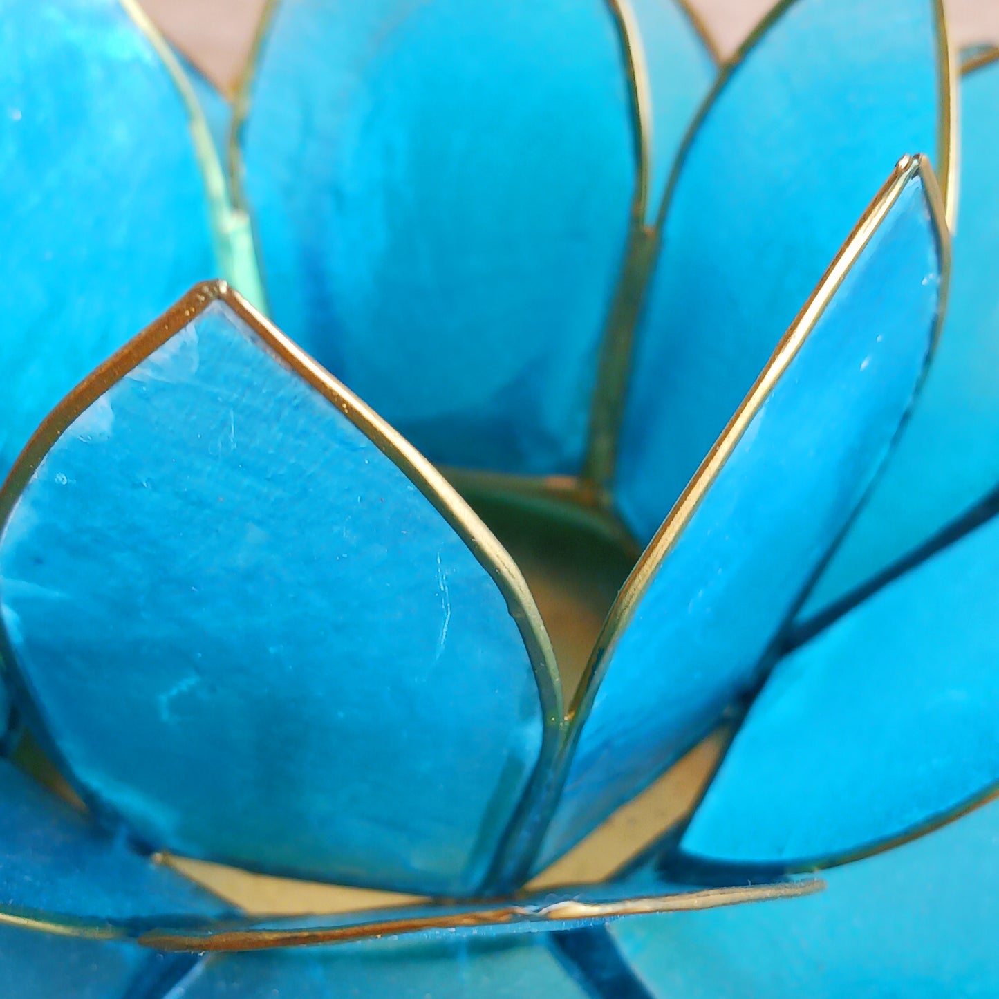 The Lotus Flower is a symbol of achieving enlightenment, peacefulness and spirituality. This beautiful candle holder can be fitted with tealight candles or slightly larger candles. The diameter of the middle is roughly 5.5cm, so it will fit any candle with the same diameter.
