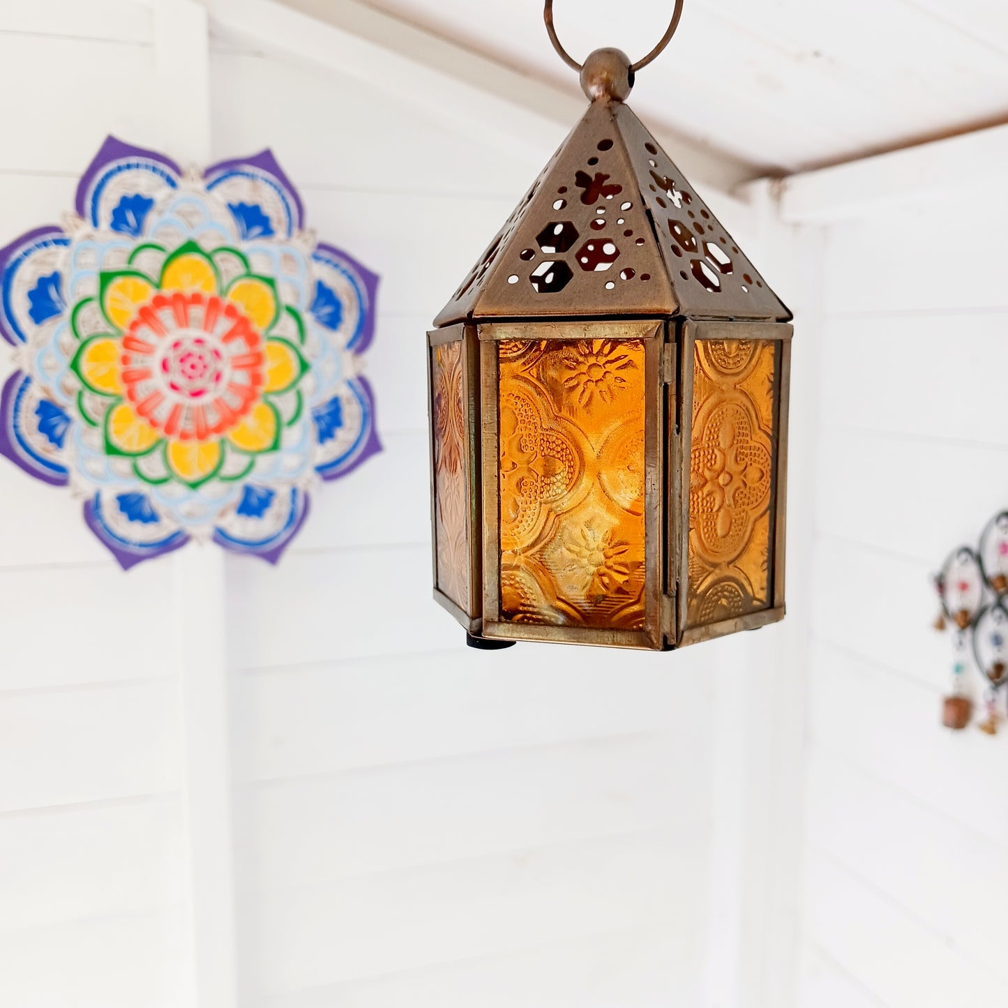 This cute little tealight lantern has honeycomb and bee cut outs crafted into the antique brass coloured metal. Open the small hinged door to add a tealight and close with the sliding latch. A super gift idea for gardeners and nature lovers. Ideal as indoor table centrepieces and summer table decorations for garden parties and eating alfresco. Light to provide a comforting indoor glow on darker days.