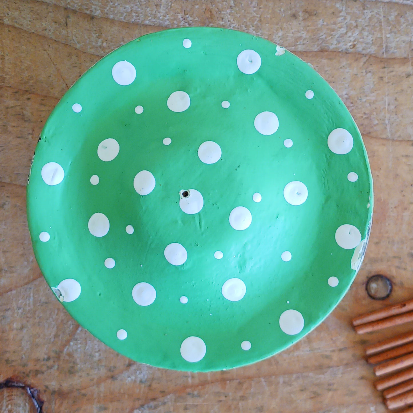 Bring woodland charm to your space with these hand-painted wooden mushroom incense holders. Each piece features a white stalk and a vibrant, spotty cap in your choice of blue, green or red. Designed with a central incense stick holder, these mushrooms are perfect for adding a whimsical, on-trend touch to your décor.