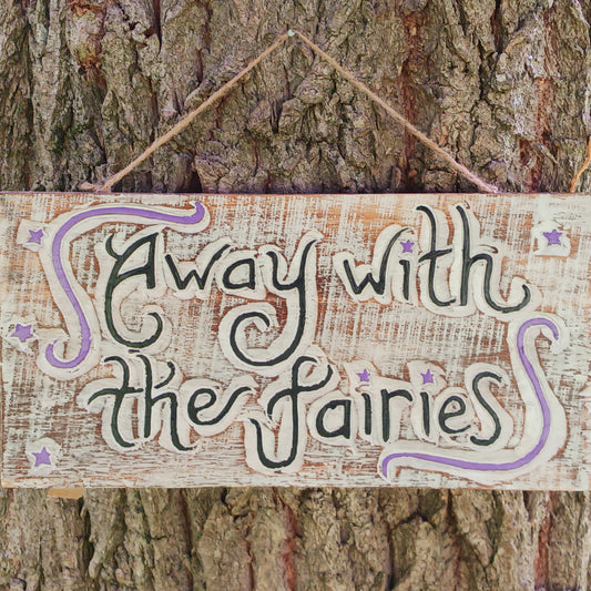 Whimsical handmade wall plaque with fairy-themed design. Ideal for gardens or interiors. Crafted in Indonesia with etched text and colourful star accents.