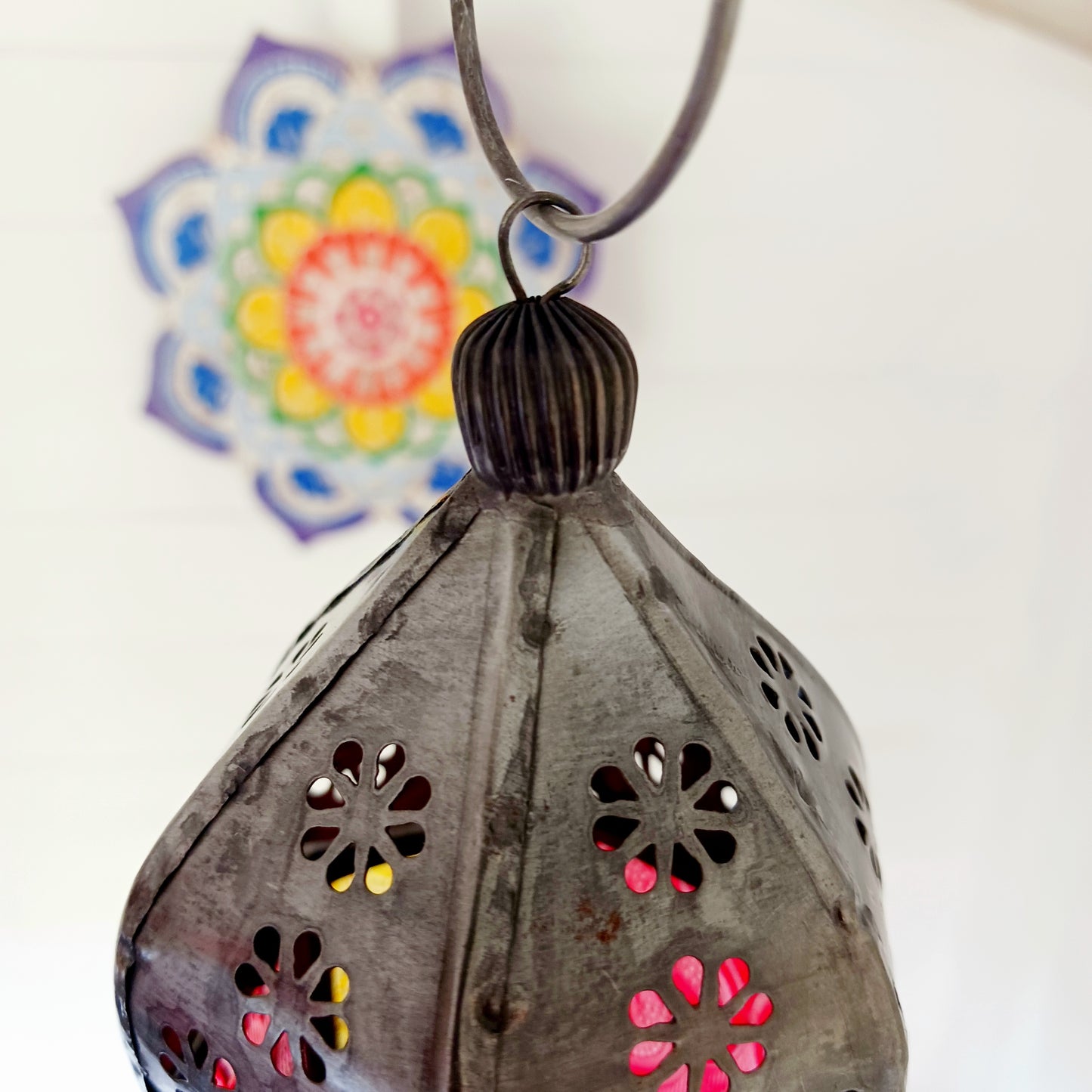 These small glass lanterns come in wonderful colours, featuring an intricate embossed pattern. They have a small hinged door that closes with a sliding catch. The small handle on the top is great for hanging the lanterns around your home. Perfect for adding a touch of warmth to your space.