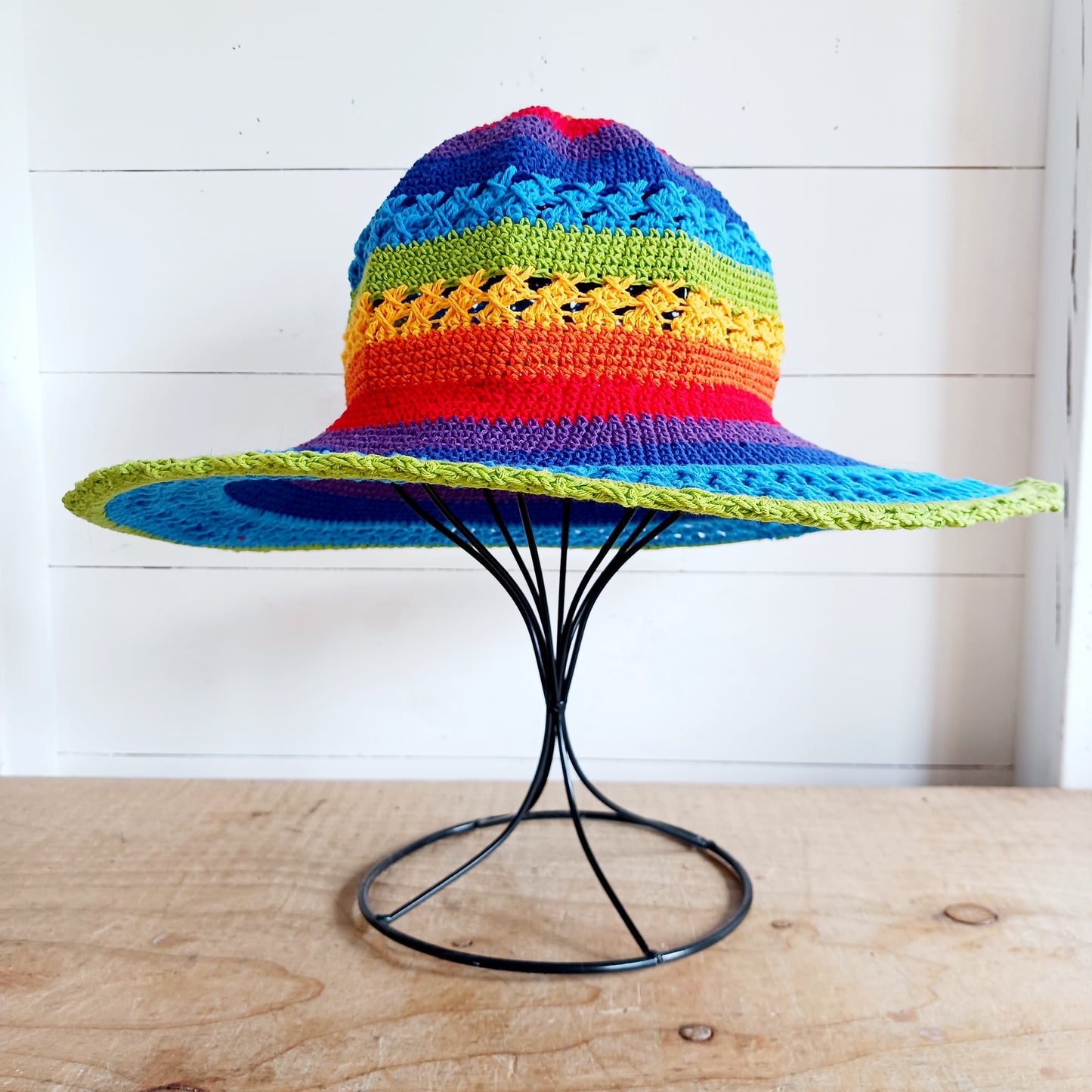 Handmade rainbow crochet sun hat with a flexible brim. Perfect for holidays, beach days & festivals. Unique, lightweight, and ready for sunny adventures!