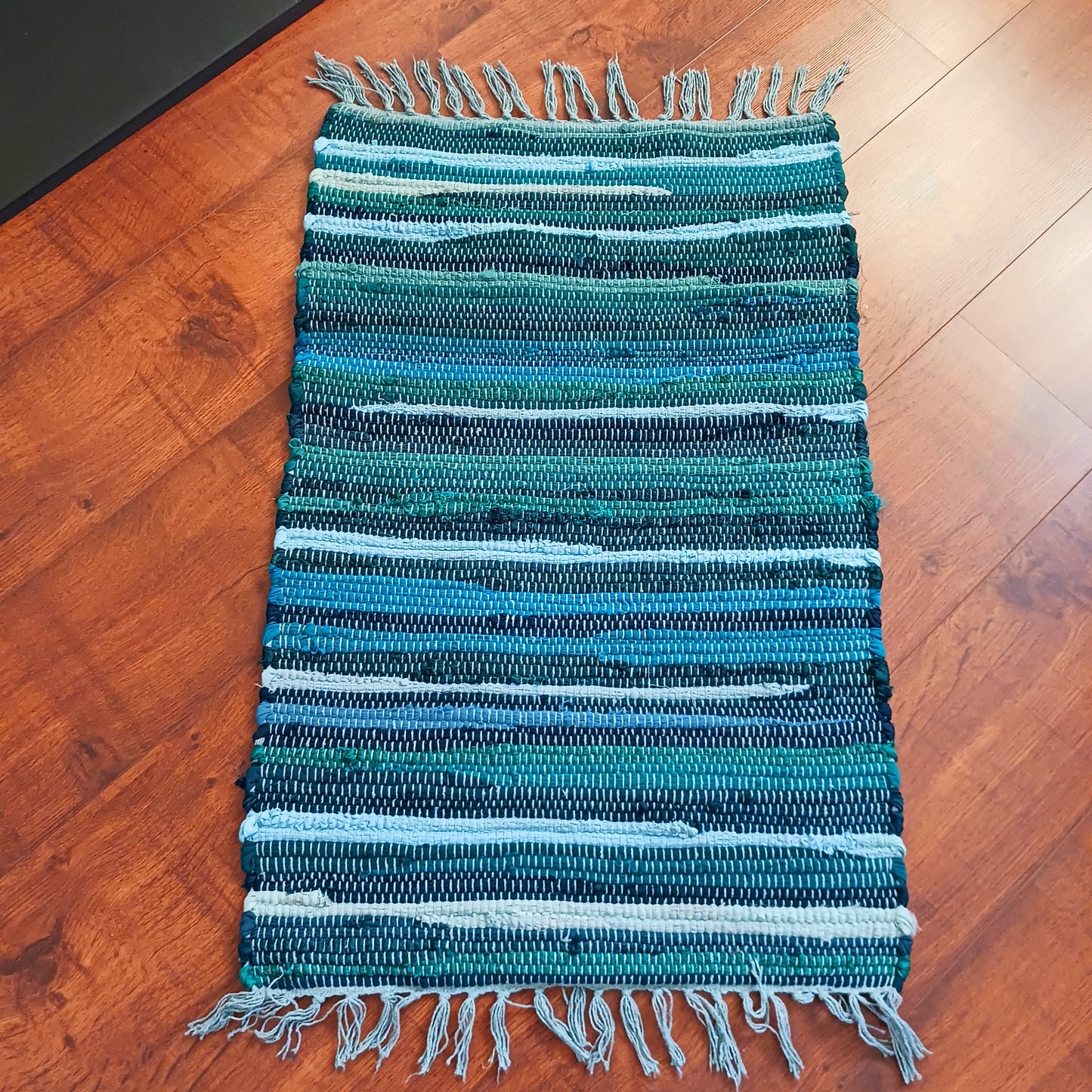 Enhance your living space with this premuim quality rag rug. Whether used in kitchens, bathrooms, or even as a decorative accent in bedrooms and living rooms, the aqua blues will bring a sense of serenity and freshness to any environment.