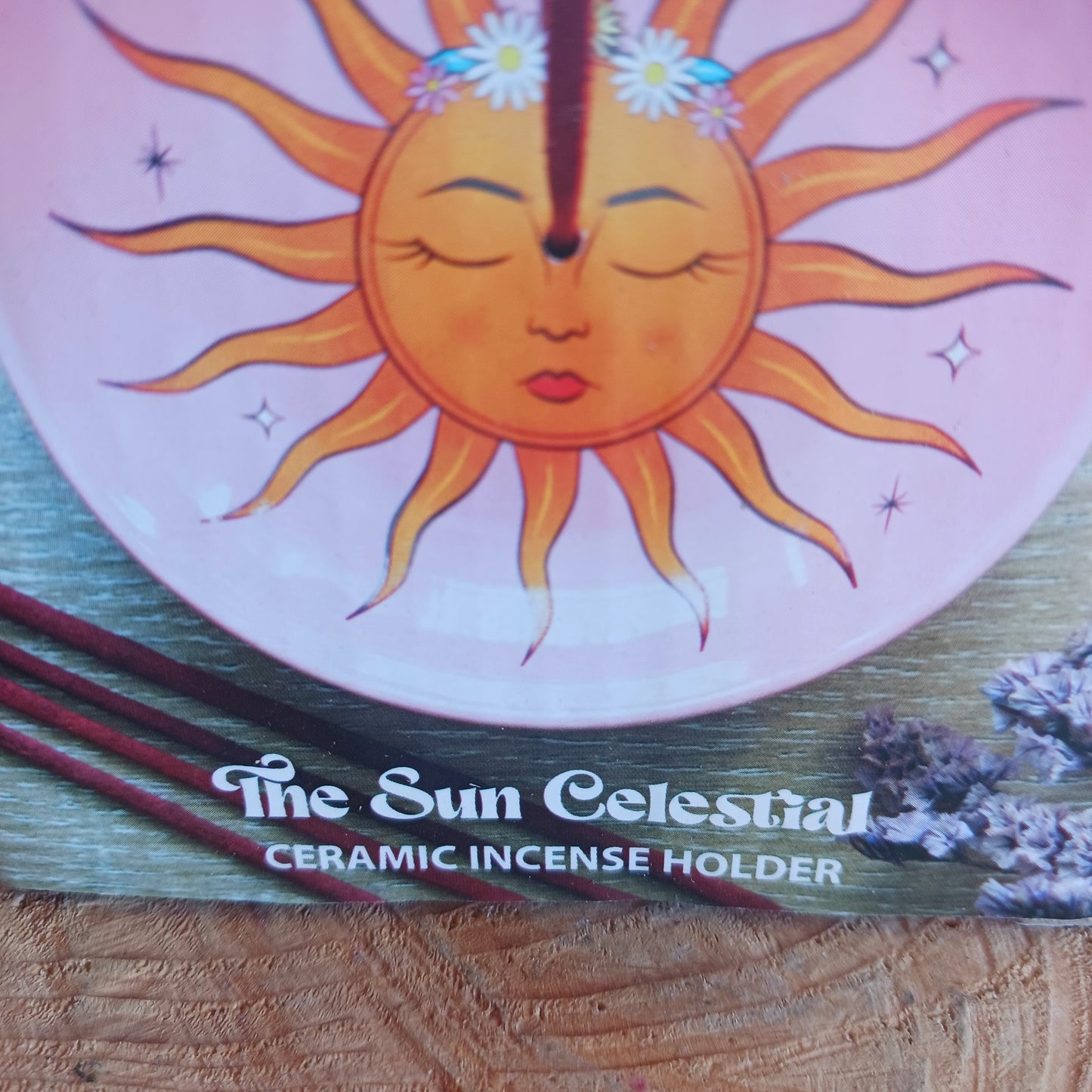 This modern incense stick holder features a lovely warm colourful sun design inspired by 'The Sun' tarot card. This ceramic dish provides a stylish and practical way to enjoy incense.