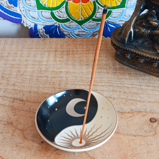 Bring harmony and calm to your space with our Celestial Yin Yang Incense Holder Dish. Crafted with a peaceful celestial design, this incense dish is perfect for holding your favourite calming scents. Whether you're meditating, practicing yoga, or simply unwinding after a long day, this elegant piece adds a serene touch to your zen oasis. Designed to catch ash neatly while enhancing your décor, it’s both functional and beautiful. Ideal for any mindful moment.