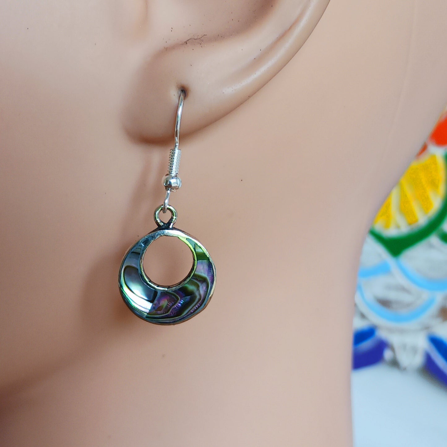 Rock the 'jefa' ('girl boss') look with these small but stylish hoop earrings crafted from iridescent abalone shell.