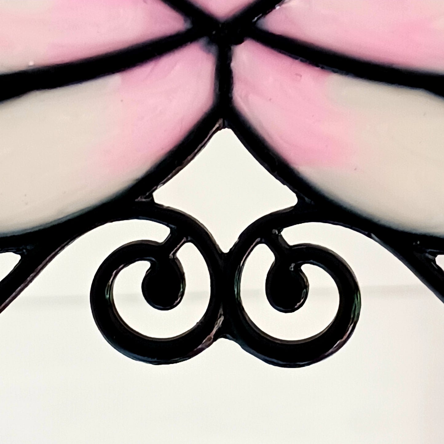 Bring a touch of tranquility to your space with this beautifully crafted lotus flower window hanger. Made from coloured glass and outlined in sleek metal framing, this piece combines simplicity and elegance. When sunlight passes through, it creates a radiant, uplifting display of colour. Hang it in any window to inspire peace, mindfulness, and beauty in your home or workspace.