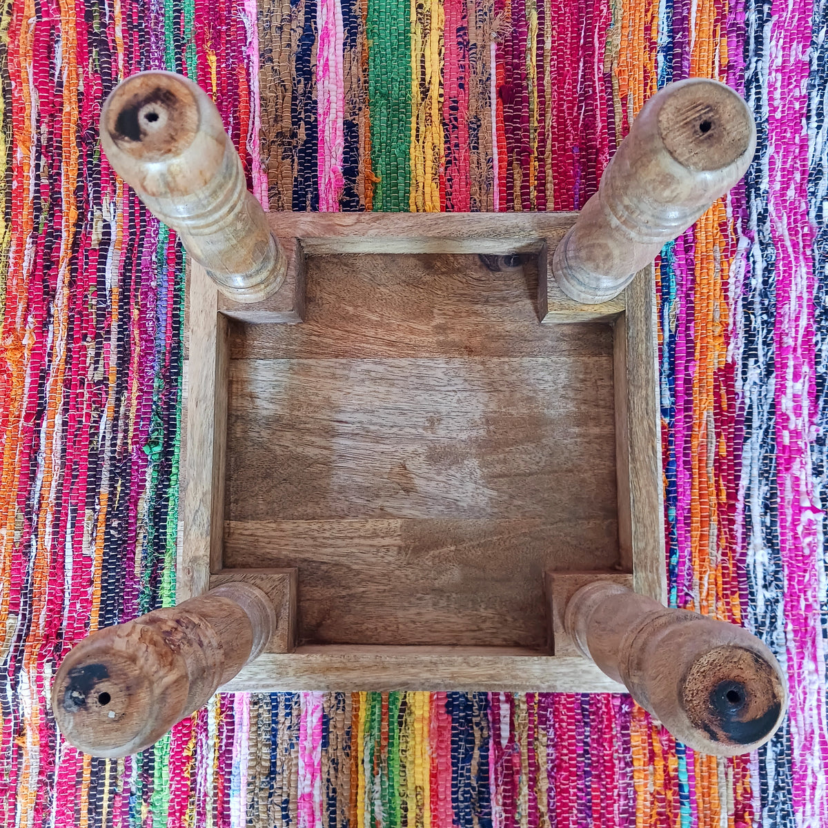 Bring peace and tranquillity to your home with this beautiful handcrafted mango wood table, featuring an intricately carved Buddha and Lotus Flower design on the tabletop. Combining traditional craftsmanship with spiritual symbolism, this unique wooden table makes a wonderful addition to a meditation space, Buddhist altar, yoga room or peaceful home sanctuary.