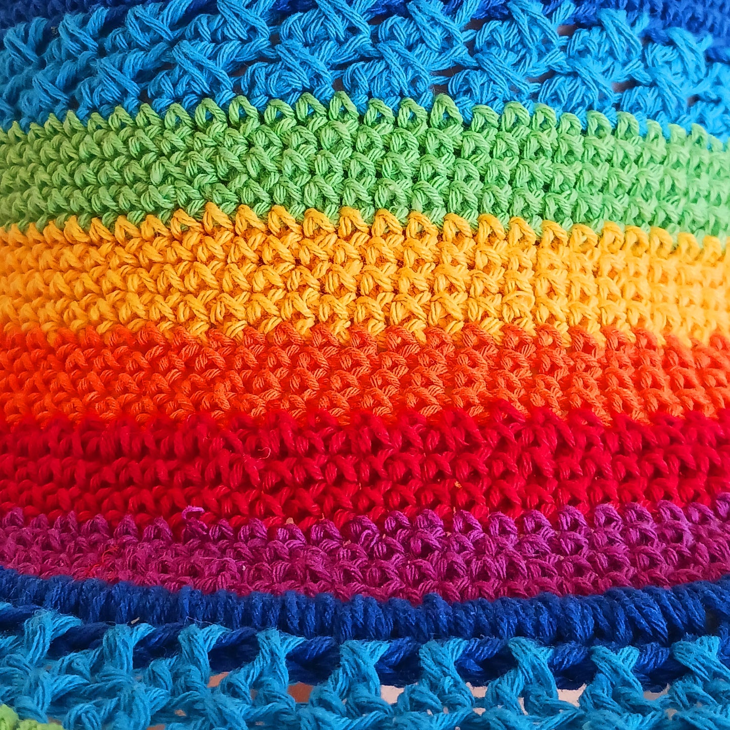This lovely crochet cotton summer sun hat is perfect for summertime with it's vibrant rainbow colours. Each hat has a malleable wire woven into the rim to help keep the shape. Ideal for holidays and festivals.