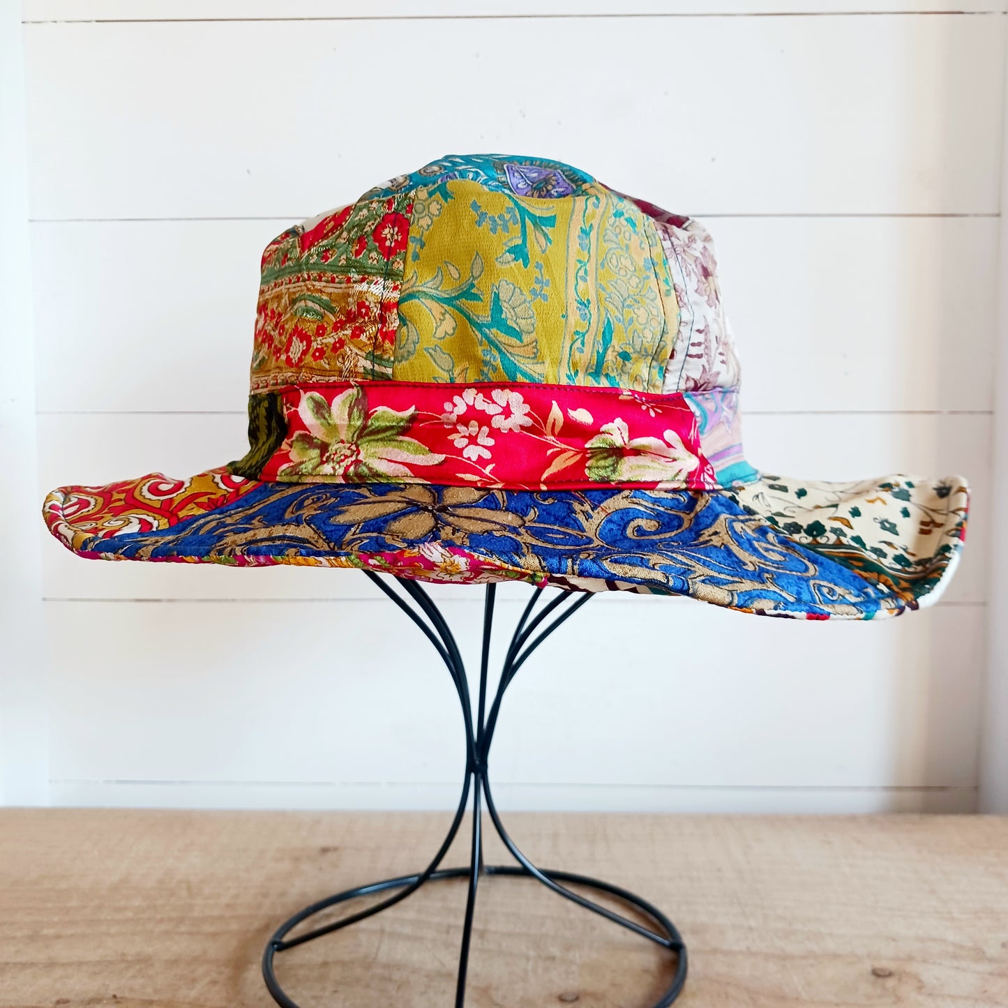 A swell little number for festivals and summer times, you'll look the coolest in this recycled sari patchwork sun hat. Black polyester lined, with a slightly flexible brim for adjusting the shape.
