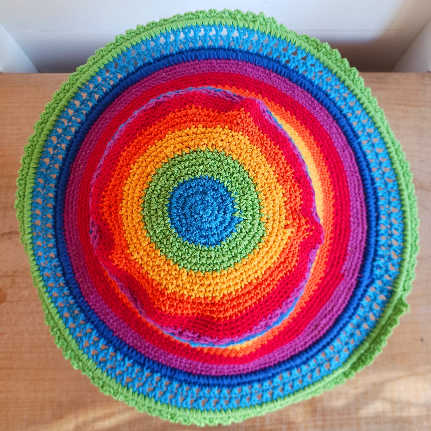 This lovely crochet cotton summer sun hat is perfect for summertime with it's vibrant rainbow colours. Each hat has a malleable wire woven into the rim to help keep the shape. Ideal for holidays and festivals.