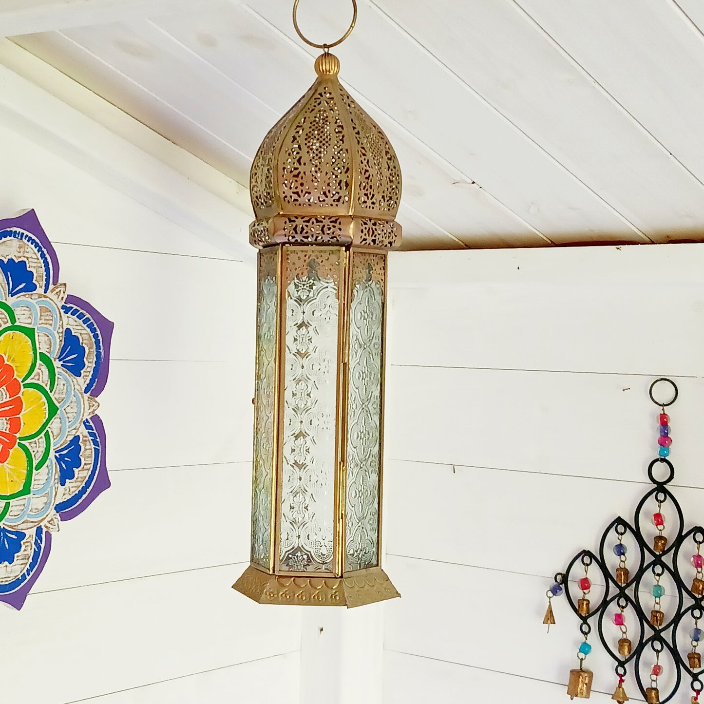 This antique brass Moroccan style large glass lantern has clear embossed glass panes and a wonderful antique finish. A stylish and versatile addition to any home, this beautiful lantern is ideal to bright up your home.