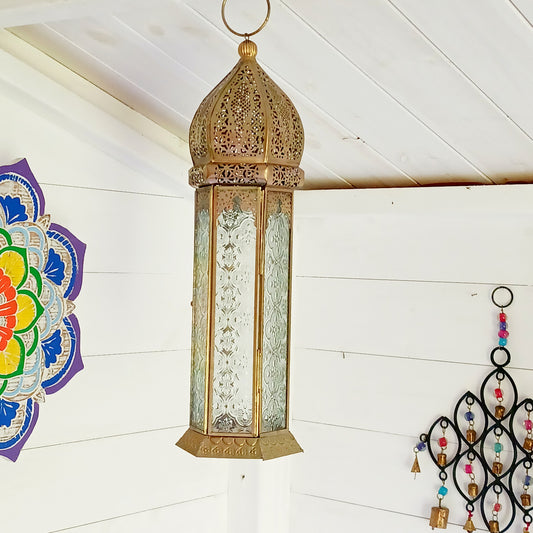 This antique brass Moroccan style large glass lantern has clear embossed glass panes and a wonderful antique finish. A stylish and versatile addition to any home, this beautiful lantern is ideal to bright up your home.