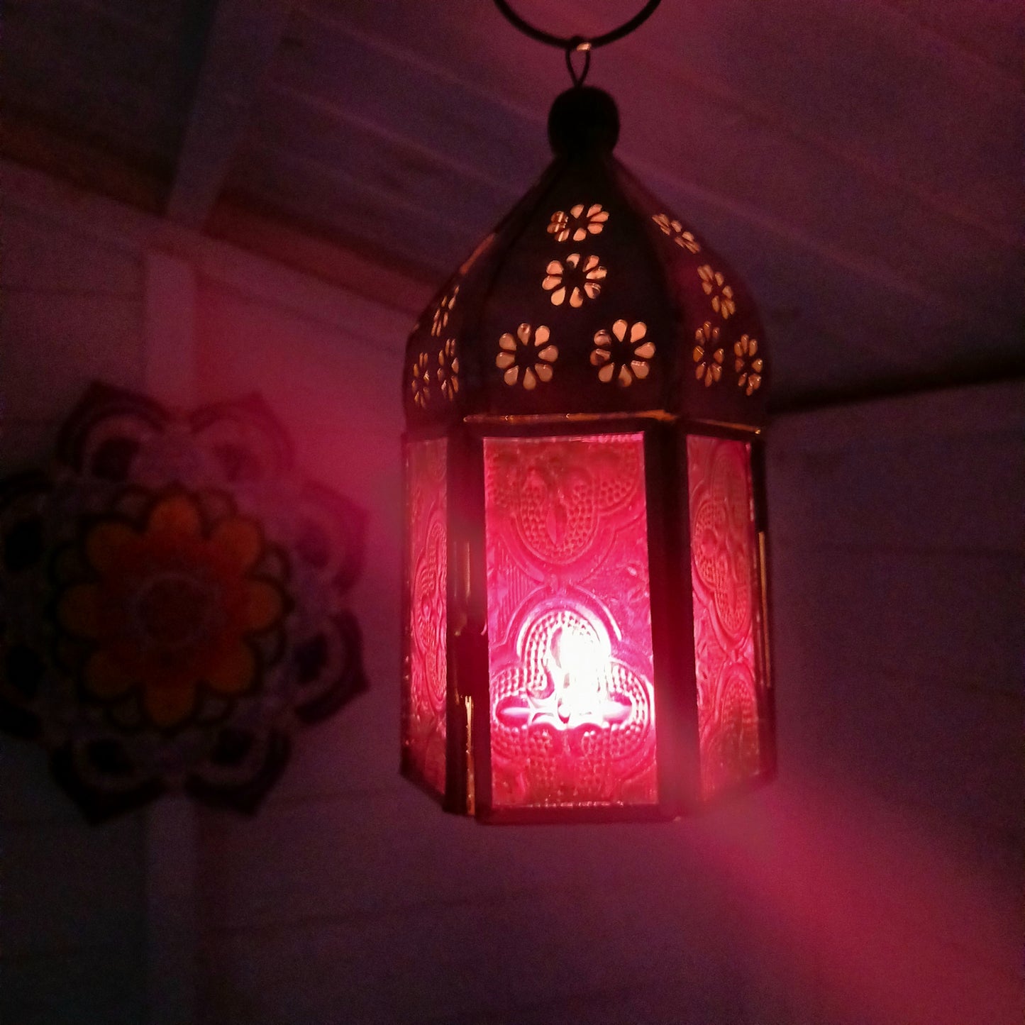 These small glass lanterns come in wonderful colours, featuring an intricate embossed pattern. They have a small hinged door that closes with a sliding catch. The small handle on the top is great for hanging the lanterns around your home. Perfect for adding a touch of warmth to your space.
