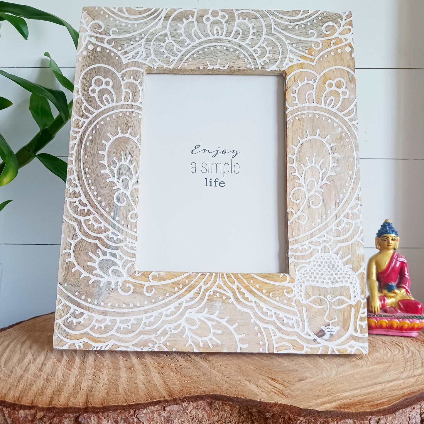 Made in India from sustainably sourced mango wood, these lovely picture frames bring warmth, character, and meaning to any space. Each one is carefully carved or painted with spiritual and cultural designs that go beyond decoration holding deep symbolism and tradition. The small Buddha in the corner is a peaceful presence that represents wisdom and enlightenment. Ideal for meditation spaces, yoga studios, or anyone seeking a sense of calm.
