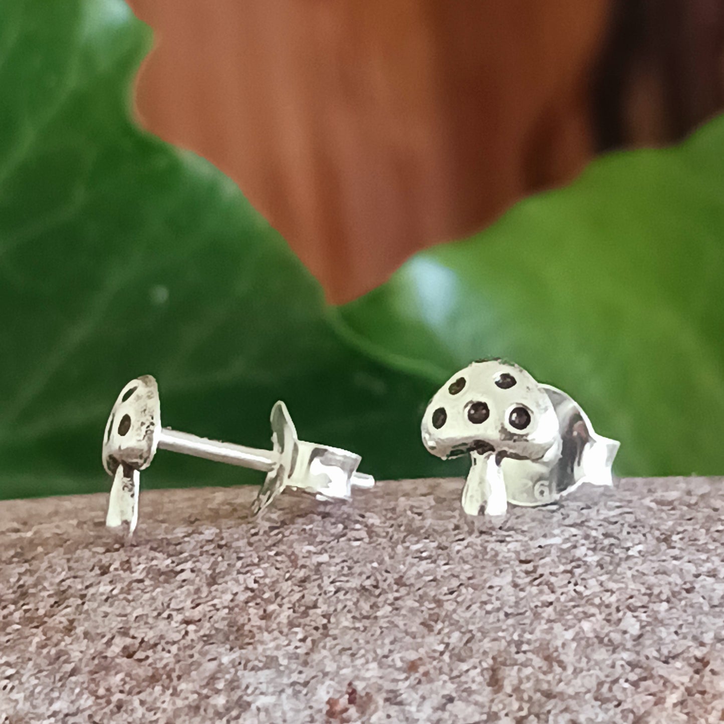 These Mushroom 925 Sterling Silver Ear Studs are the perfect accessory for any outfit. Crafted from 925 sterling silver, they feature a stylish 6mm x 5mm mushroom design and come presented in a beautiful recycled sari gift pouch.