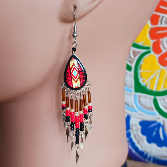 Add a touch of artisan elegance to your jewellery collection with these stunning handmade Peruvian Incan teardrop earrings. Carefully crafted in small family-run workshops in Peru, these eye-catching earrings feature traditional Incan-inspired patterns on the front with a contrasting black reverse for a striking finish.