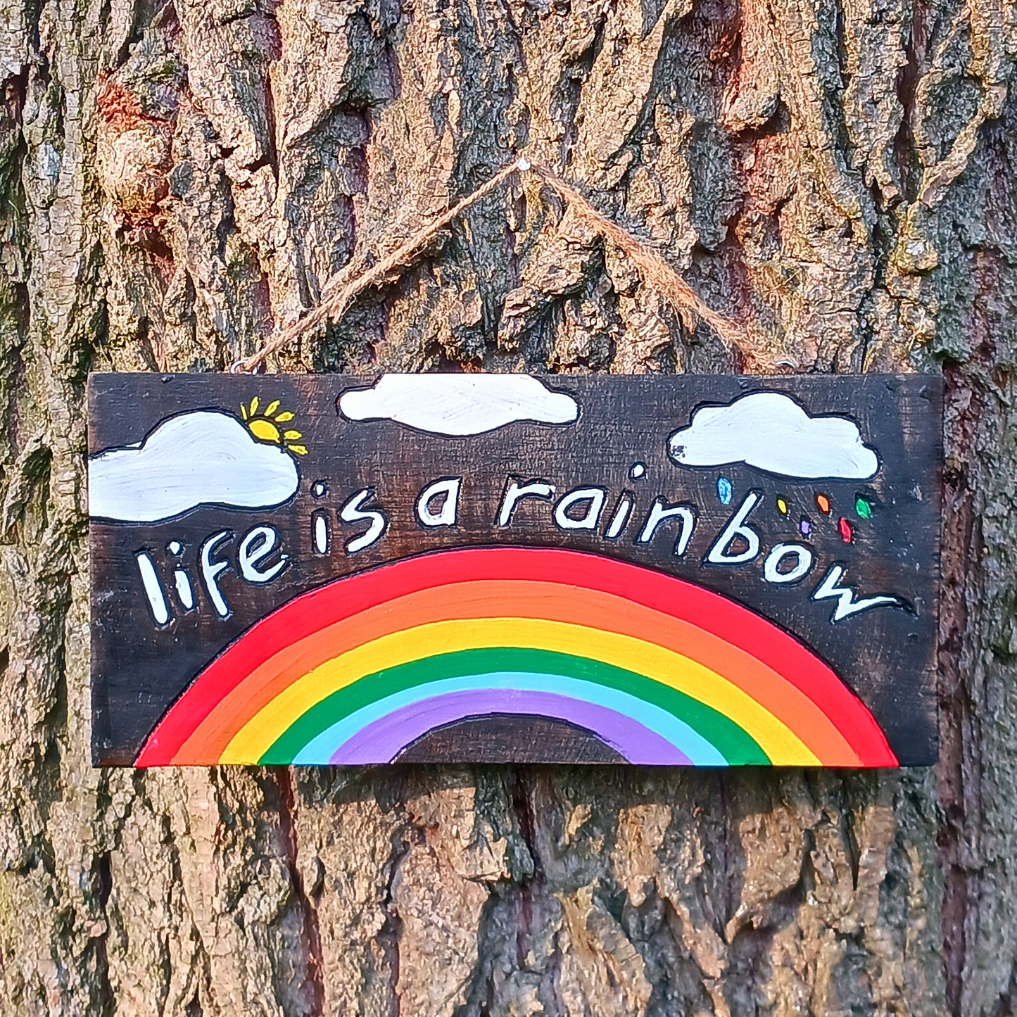 Hang this delightful plaque anywhere to bring a ray of sunshine to your day! A vibrant hand painted design on contrasting dark wood gives this plaque the full wow factor.