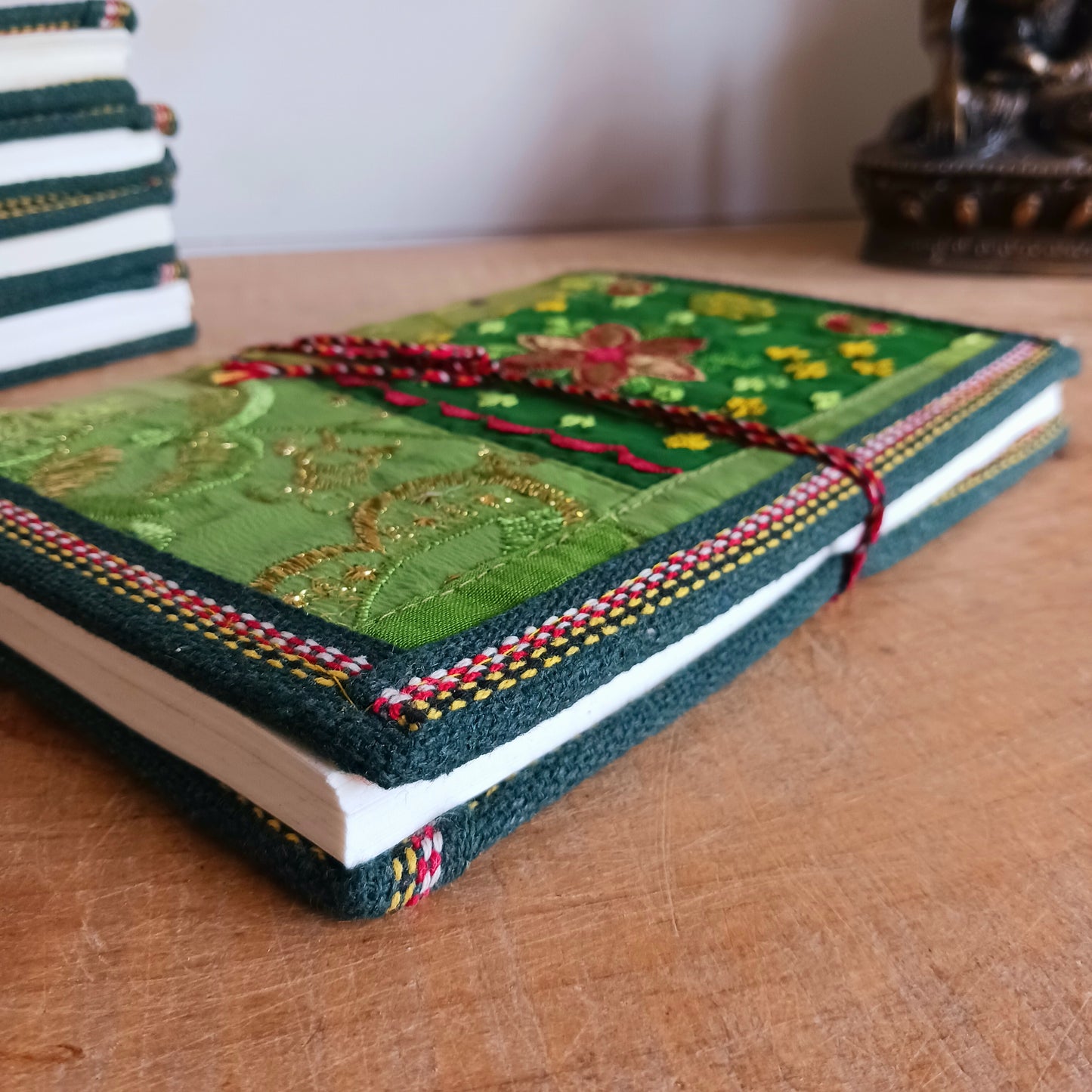 This beautifully bound notebook with handmade paper is from recycled cotton. An imaginative use for sari offcut material, the cover is edged and framed with pretty brocade material to complete a lovely and unique eco friendly stationery gift.